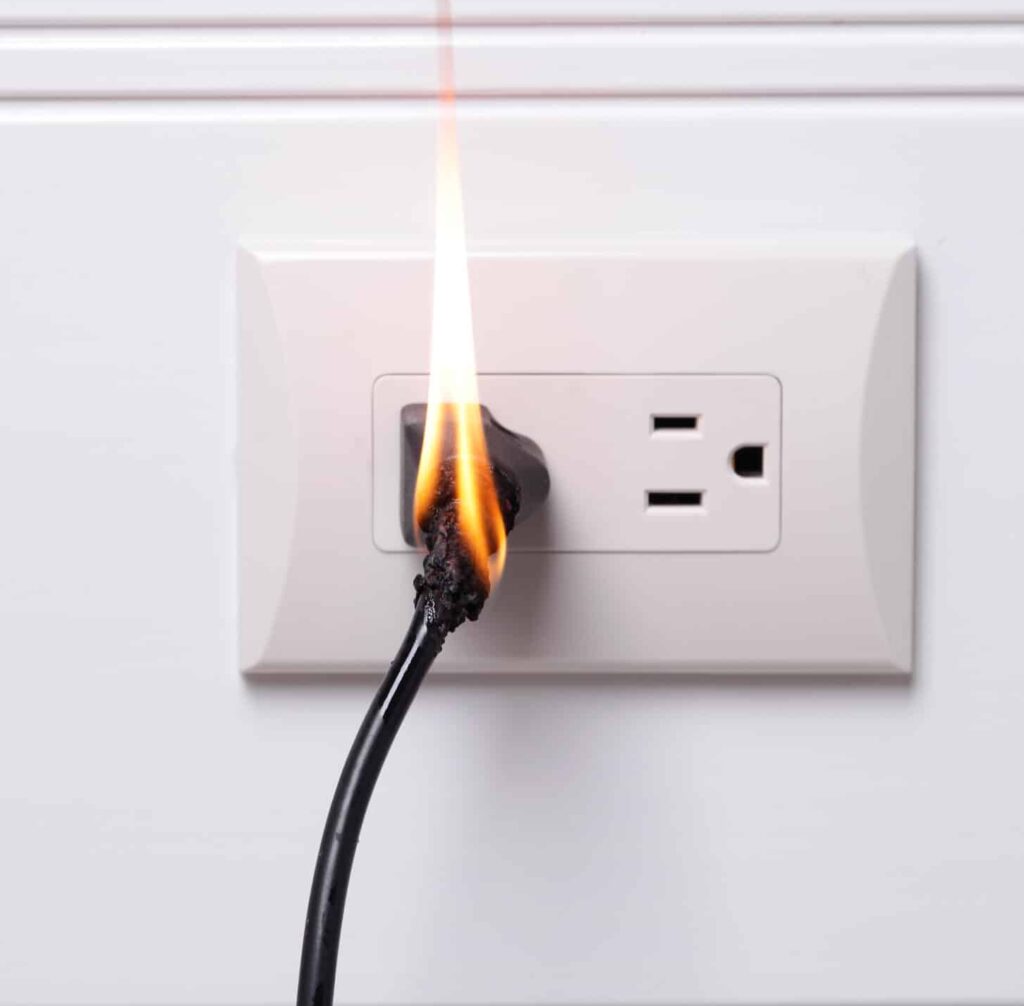 Backstabbed electrical outlet on fire
